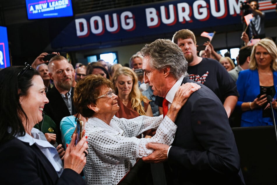 North Dakota Governor Doug Burgum speaks with supporters after joining a growing field of candidates hoping to topple Donald Trump and secure the Republican nomination for president.
