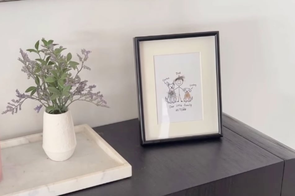 Now, the picture is on a dresser in the hallway.
