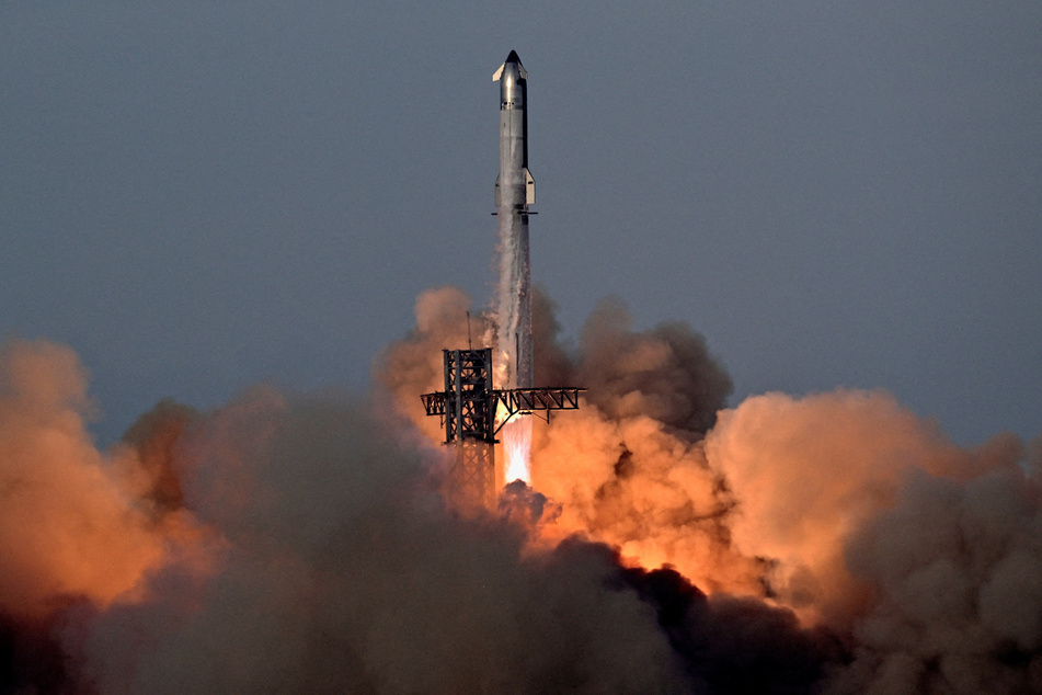 A SpaceX Super Heavy booster carrying the Starship spacecraft blasts off on its 10th test flight at the company's launch pad in Texas on August 26, 2025.