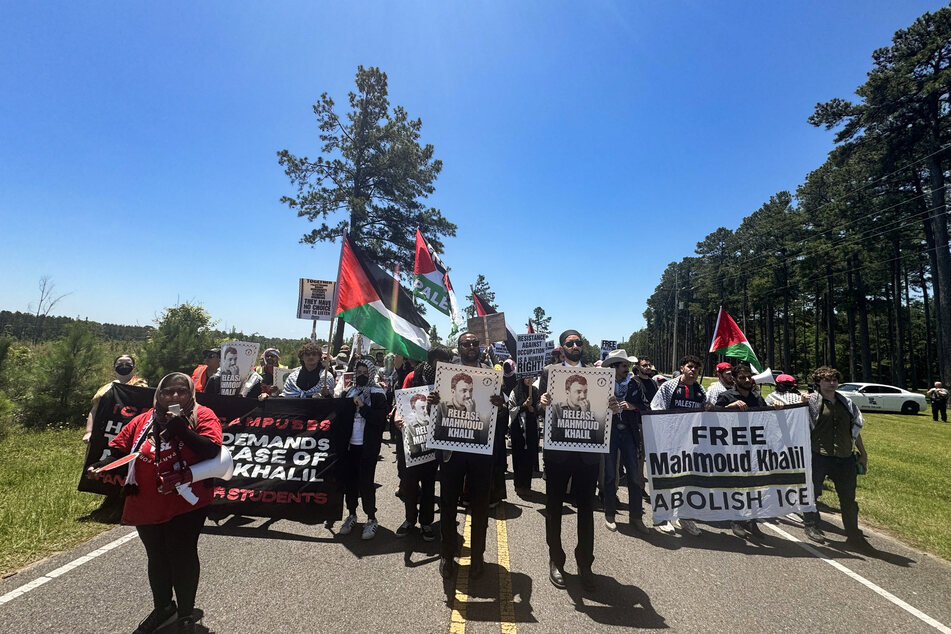 Mahmoud Khalil holds son for first time as protesters turn out in force for immigration hearing