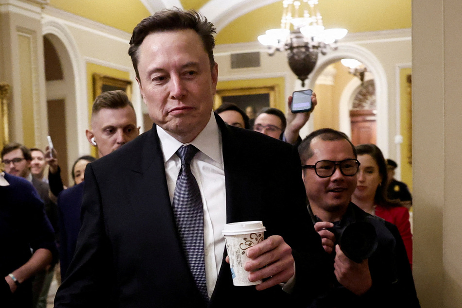Elon Musk walks on Capitol Hill on the day of a meeting with Senate Republican Leader-elect John Thune on December 5, 2024.